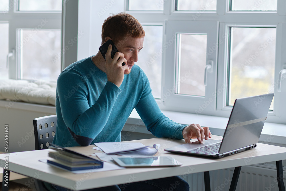 guy works from home. man using laptop, typing on keyboard, writing email or message, chatting, shopping, successful freelancer working online on computer. guy works from home. man using laptop, typing on keyboard, writing email or message, chatting, shopping, successful freelancer working online on computer.