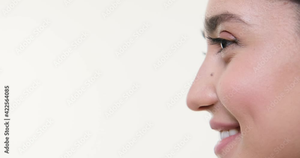 Profile face of beautiful woman smiling over white background Profile face of beautiful woman smiling over white background