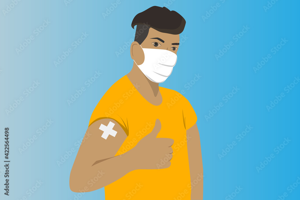 Man showing vaccinated arm.Man getting vaccinated.A man with yellow shirt and wear the face mask get the coronavirus vaccine .Person after receiving covid-19 vaccine on her arm.Vaccination concept.