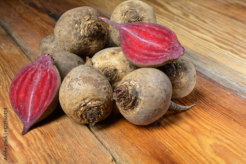 Fresh red homemade beets, whole on a wooden rustic table, vegetable food, local products, close-up.selective focus.