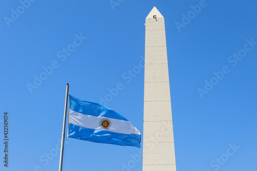 Obelisk and Argentinian flag on Avenue 9 de Julio, Buenos Aires, Argentina photo