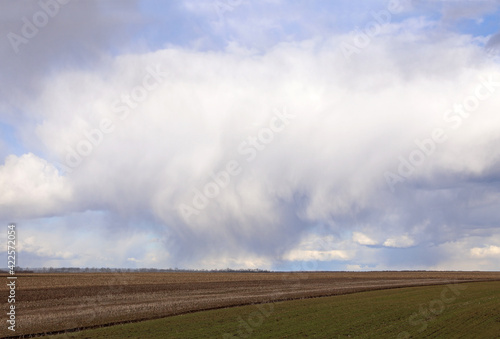 Thunderstorm with dramatic clouds. Dramatic clouds over agricultural field. Beautiful storm sky with clouds, apocalypse, tornado