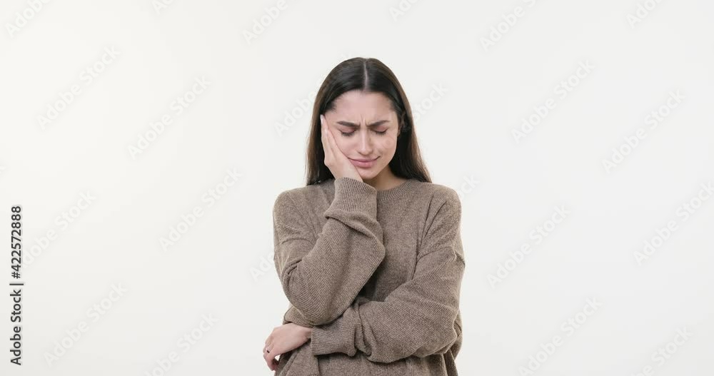 Woman suffering from toothache over white background Woman suffering from toothache over white background