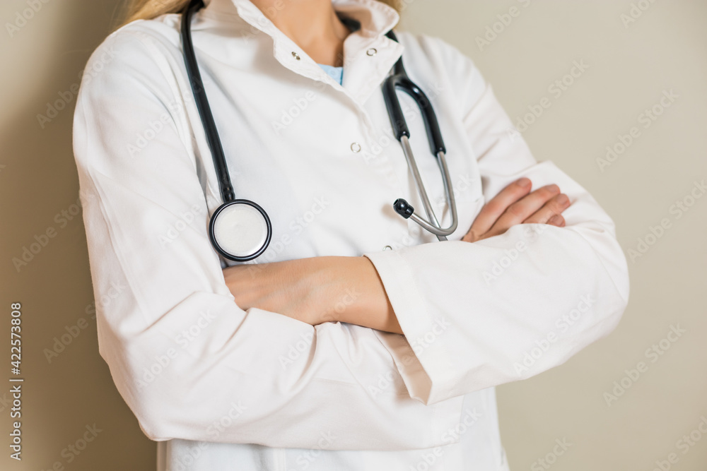 Portrait of female doctor with arms crossed. Portrait of female doctor with arms crossed.