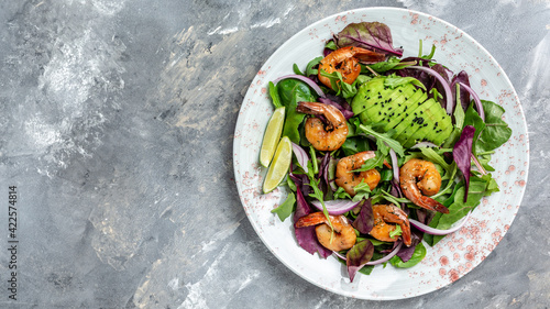 Vegan vegetarian dinner background. Green salad with avocado, blue cheese and smoked shrimps. Healthy eating concept. Detox diet. Vegetarian lunch. Weight loss. Cleanse program