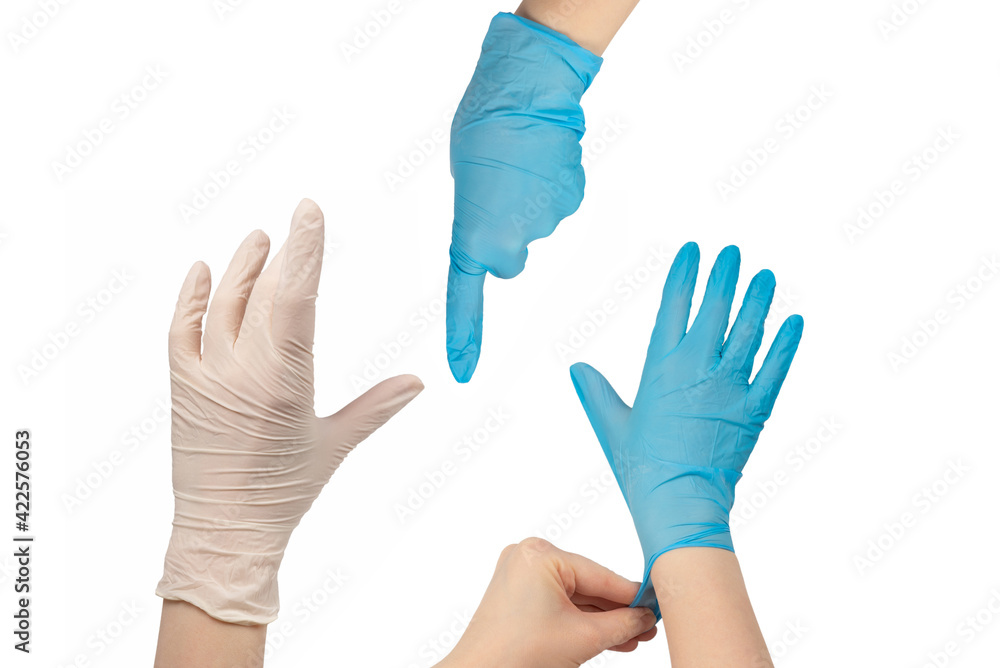 Woman puts on white rubber gloves. Woman puts on white rubber gloves.