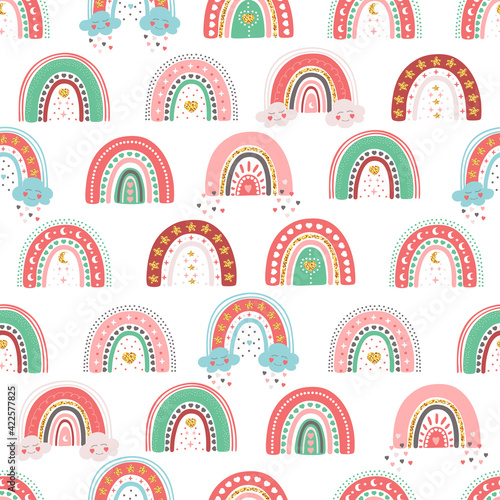 Hand drawn seamless pattern of cute rainbows with star, heart, cloud, moon. Colorful adorable doodle sketch illustration for greeting card, invitation, wallpaper, wrapping paper, fabric, baby room