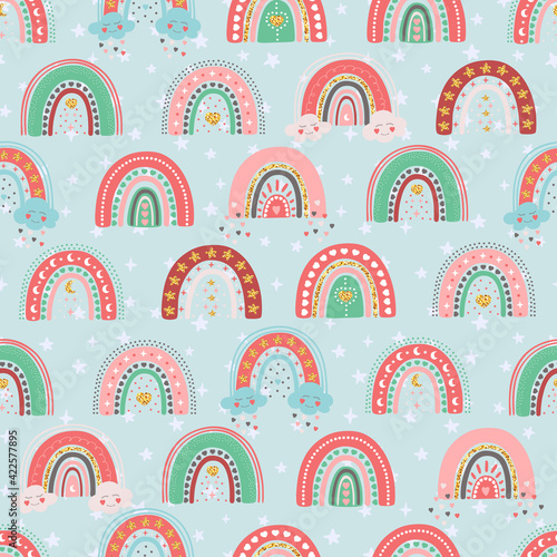 Hand drawn seamless pattern of cute rainbows with star, heart, cloud, moon. Colorful adorable doodle sketch illustration for greeting card, invitation, wallpaper, wrapping paper, fabric, baby room