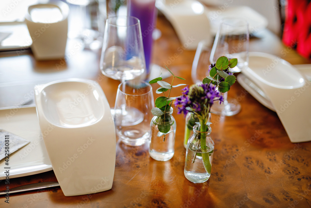 Elegant decorated table for dinner with family or friends. Fine dining at home during corona virus quarantine lockdown. Elegant decorated table for dinner with family or friends. Fine dining at home during corona virus quarantine lockdown.