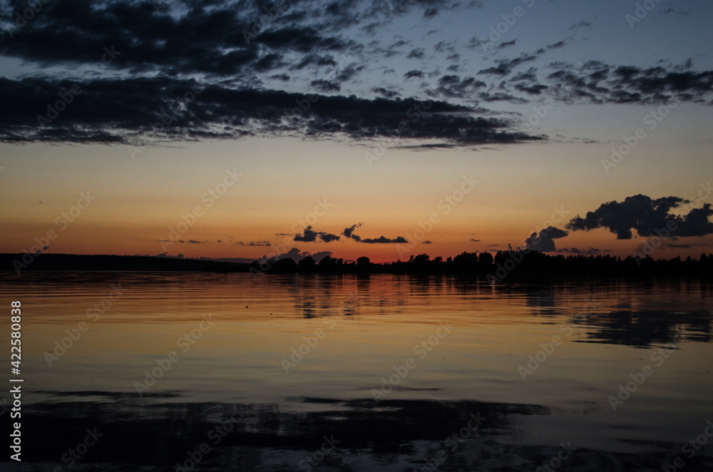 Sunset. Orange sky. Reflection in the river. Horizon Sunset. Orange sky. Reflection in the river. Horizon