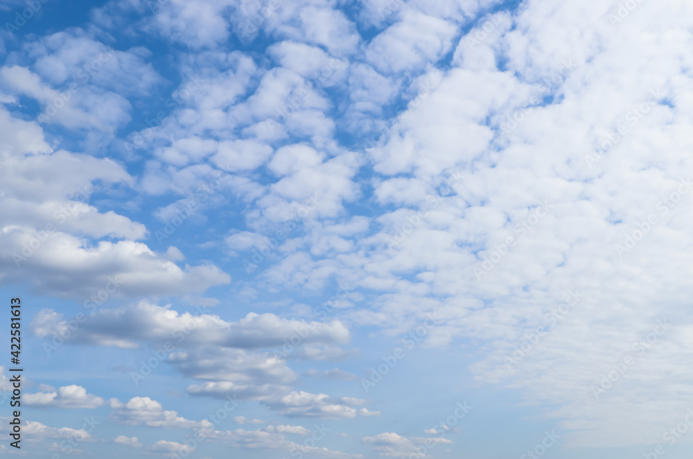 Beautiful fluffy white clouds in blue sky