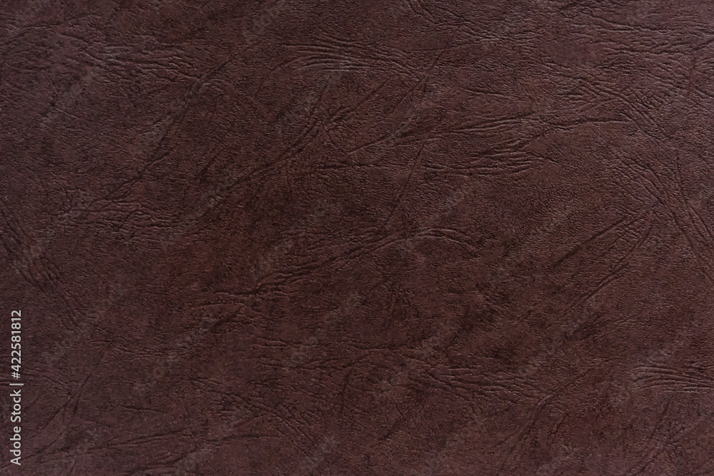 Abstract dark brown paper texture with leather-like embossing. Abstract dark brown paper texture with leather-like embossing.
