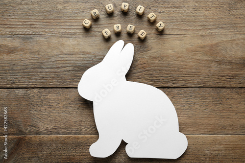 Cubes with text Cruelty Free and figure of rabbit on wooden table, flat lay. Stop animal tests