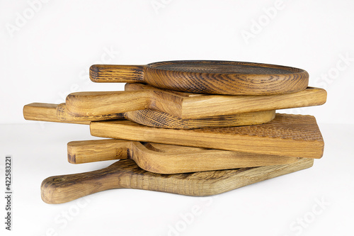 Stack of cutting boards for the kitchen on white background.