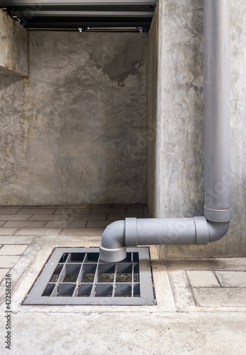 Fotografie The PVC drain pipe from the roof of the warehouse for draining rainwater