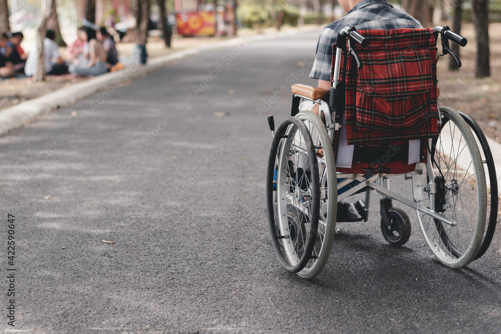Obraz premium Asian special child on wheelchair learn how to use wheelchairs on street like normal people in the city, Lifestyle in the education age of disabled children,Happy disabled kid concept, Vintage tone.