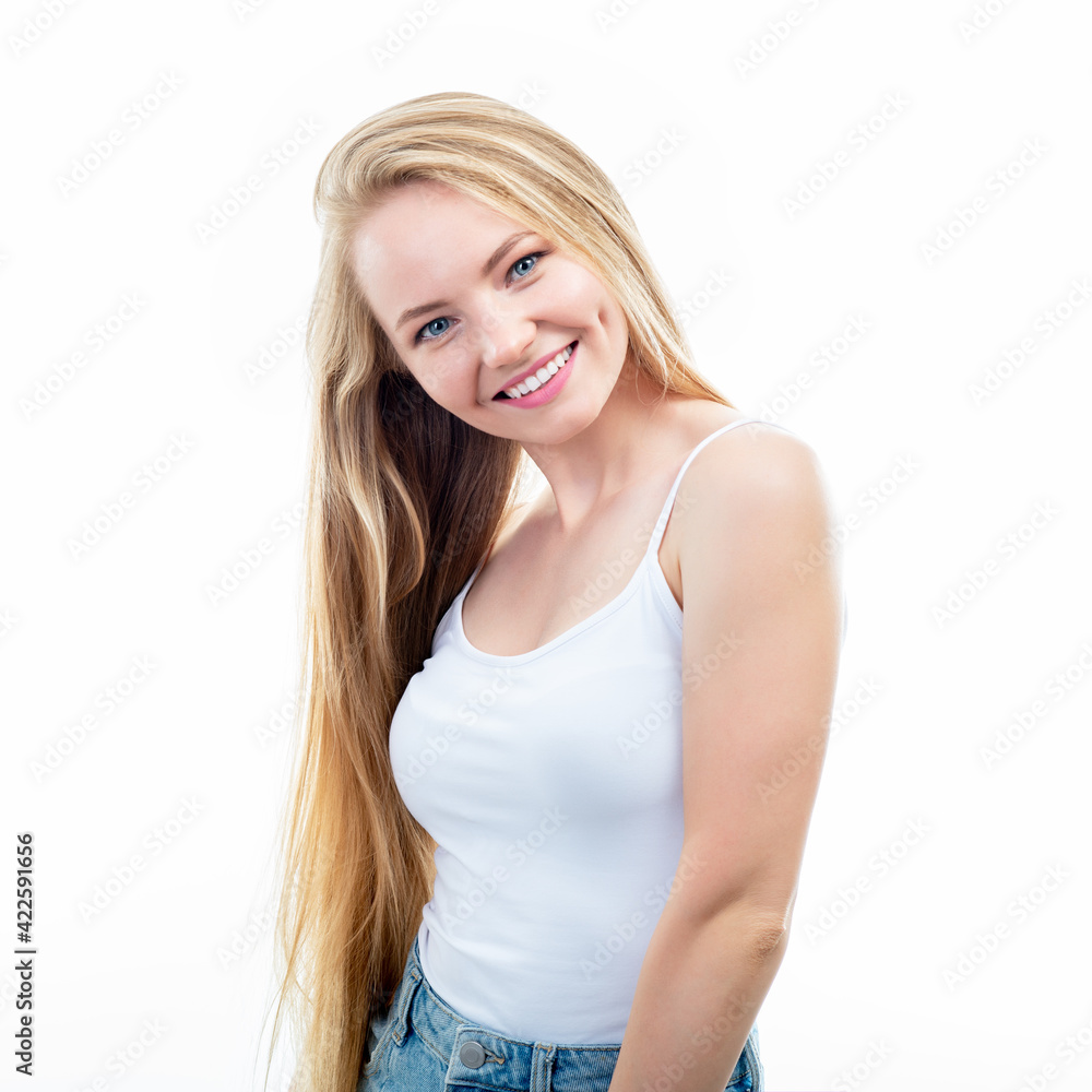Happy smiling young beautiful blond woman posing at studio over white background. Happy smiling young beautiful blond woman posing at studio over white background.