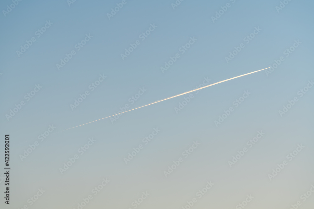 Trail of an airplane crossing the sky