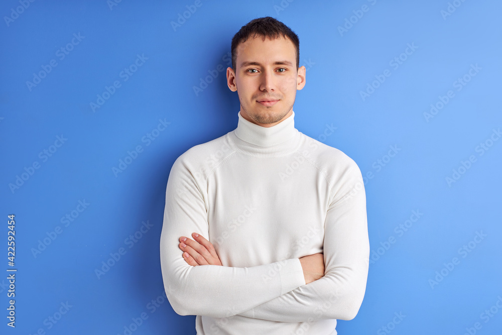 Good-looking adult man in casual wear posing at camera seriously looking Good-looking adult man in casual wear posing at camera seriously looking