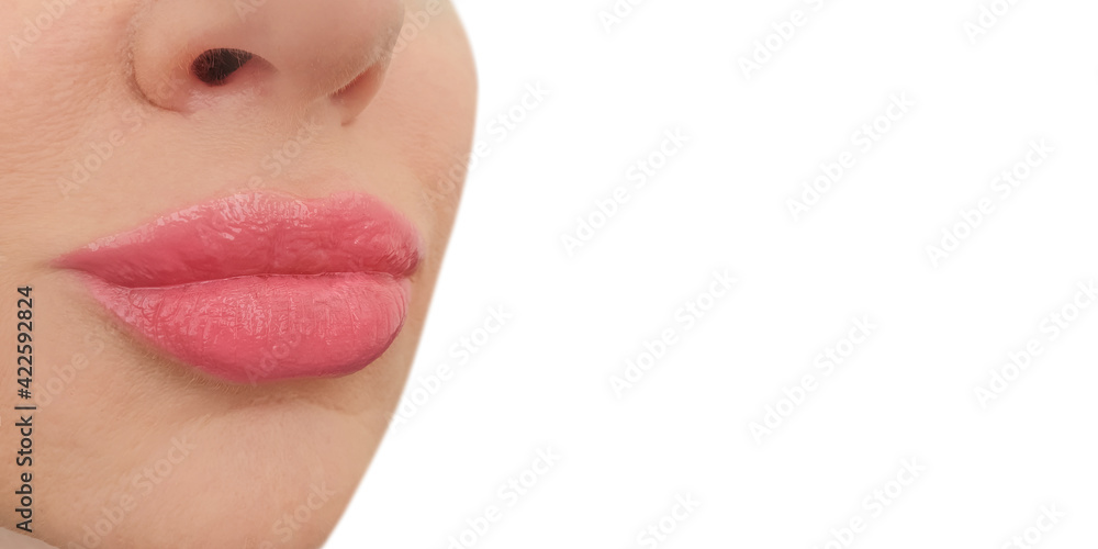 Plakat female lips close-up on a white background