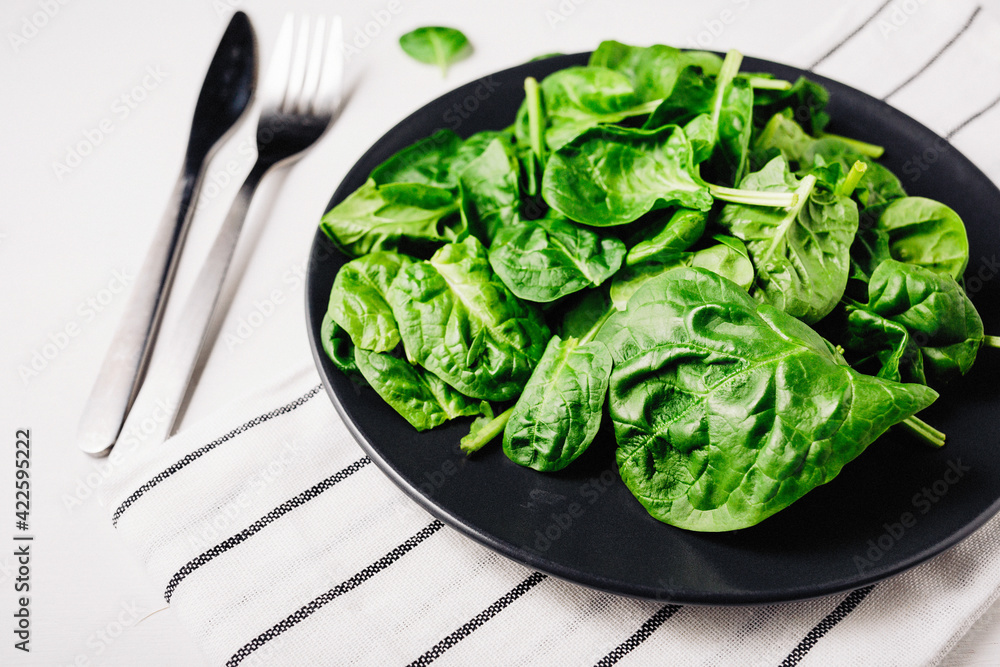 A plate of spinach view from above, healthy food detox diet A plate of spinach view from above, healthy food detox diet
