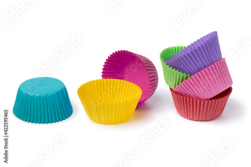 Colorful paper cupcake cups isolated on white background