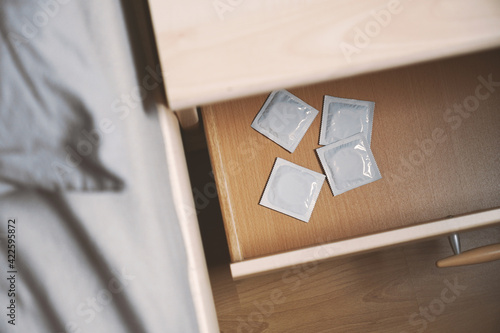 Photo condoms in bedside table or nightstand drawer