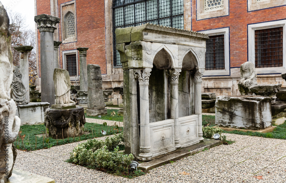 © JackF - Istanbul, Turkey - January 01, 2021: Remnants of ancient columns in the courtyard of Archaeological museum in Istanbul, Turkey