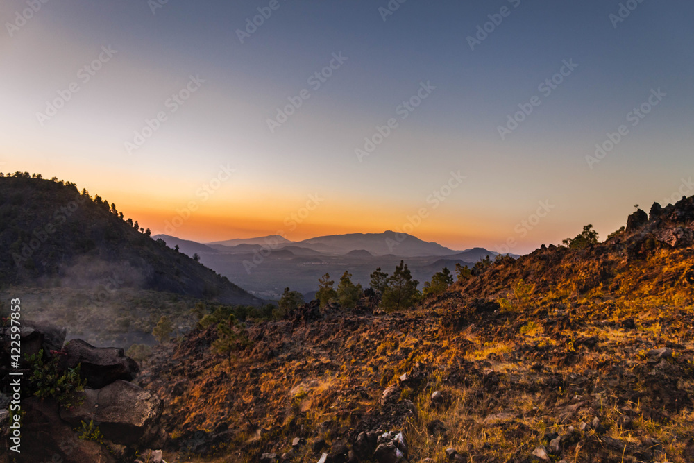 Sunset and volcanoes seen from El Paricutin, Michoacan