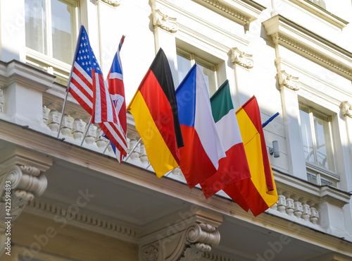 Flags of European and North American countries hanging off of balcony. Prague, Czech Republic