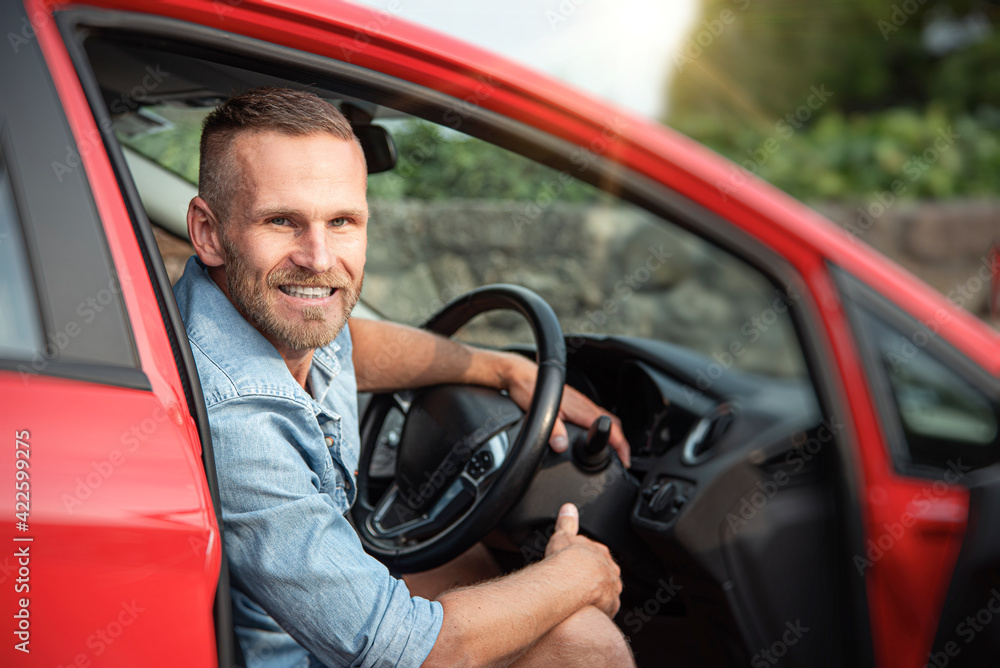 Man with a beard driving a car. Man with a beard driving a car.