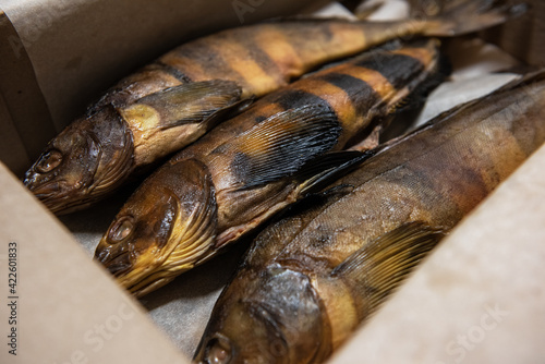Smoked fish in craft paper ...