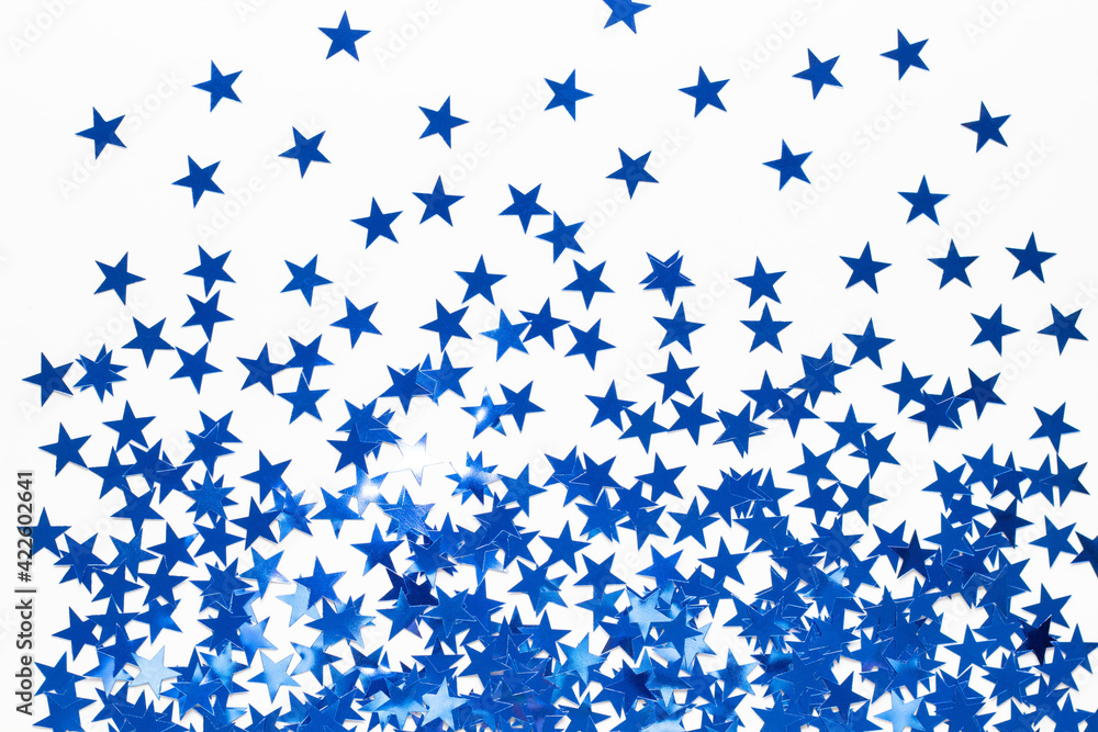 Christmas background with blue star confetti. Holiday background for New Year Christmas background with blue star confetti. Holiday background for New Year