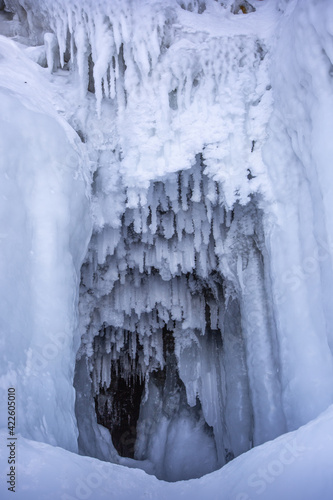 Ice cave  Icicles in the rocky caves  Lake Baikal in winter  Siberia