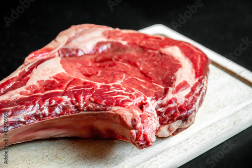 Beef prime rib on a cutting board