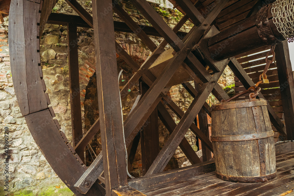 Well. An old well with a wooden bucket. Well. An old well with a wooden bucket.