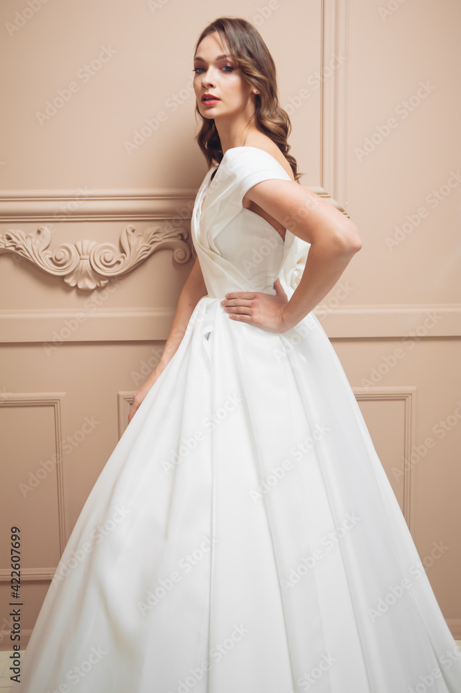 Fototapeta premium Beautiful bridesmaid dress earrings. Beautiful bride with stylish makeup and hairstyle.