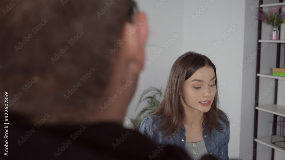 young woman quarrelling with boyfriend on blurred foreground young woman quarrelling with boyfriend on blurred foreground