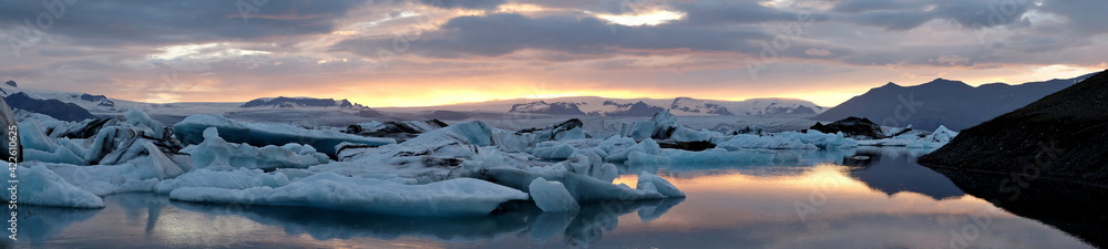 Fototapeta premium Sunset panorama over a glacier in Iceland