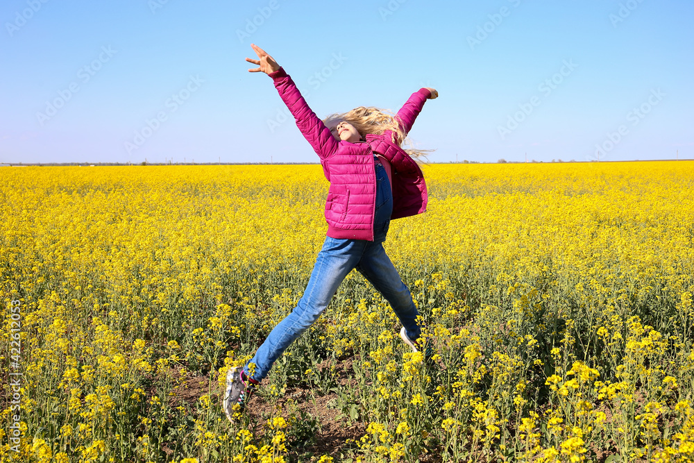 Girl jumping on the background of the field Girl jumping on the background of the field