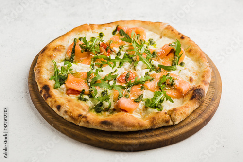 pizza with arugula and salmon