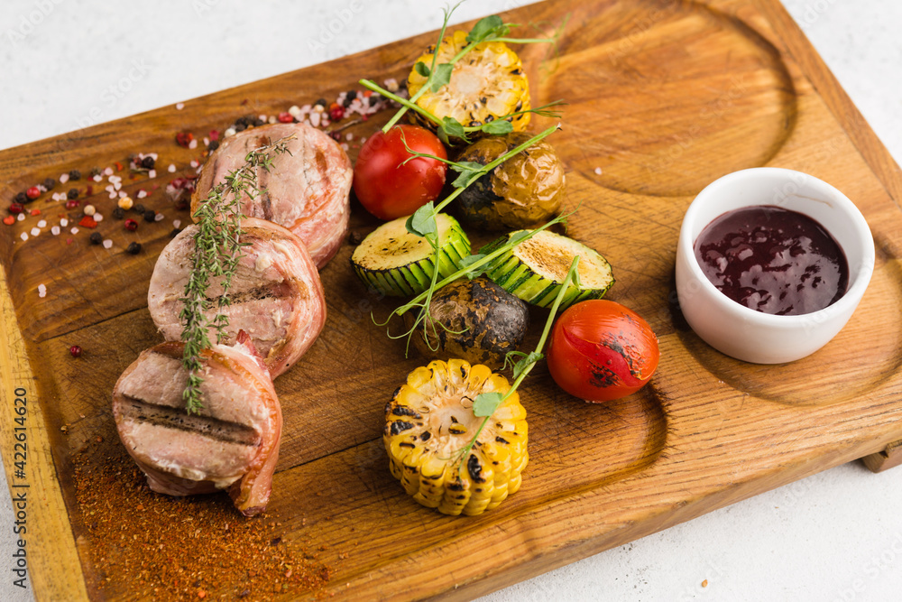 restaurant dish with grilled meat and vegetable side dish restaurant dish with grilled meat and vegetable side dish