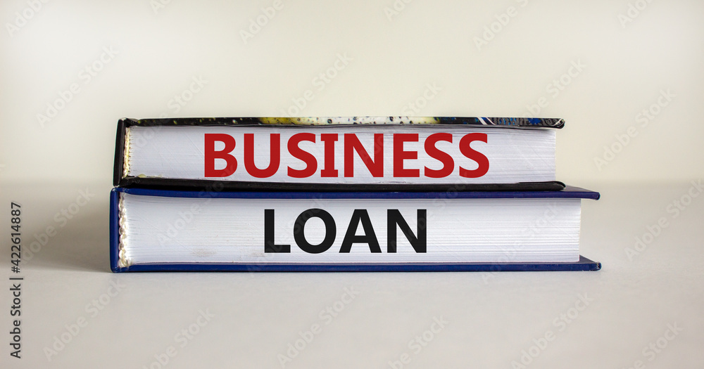 Time to business loan. Concept words 'business loan' on books on a beautiful white background. Business loan concept.