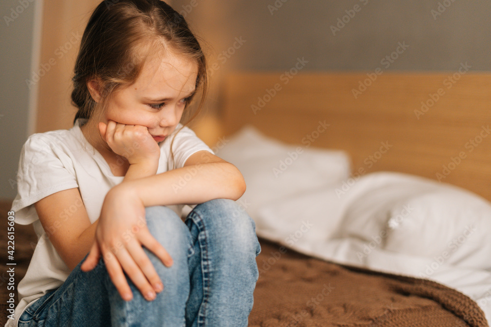 Close-up face of distraught beautiful little girl with wet eyes from ...