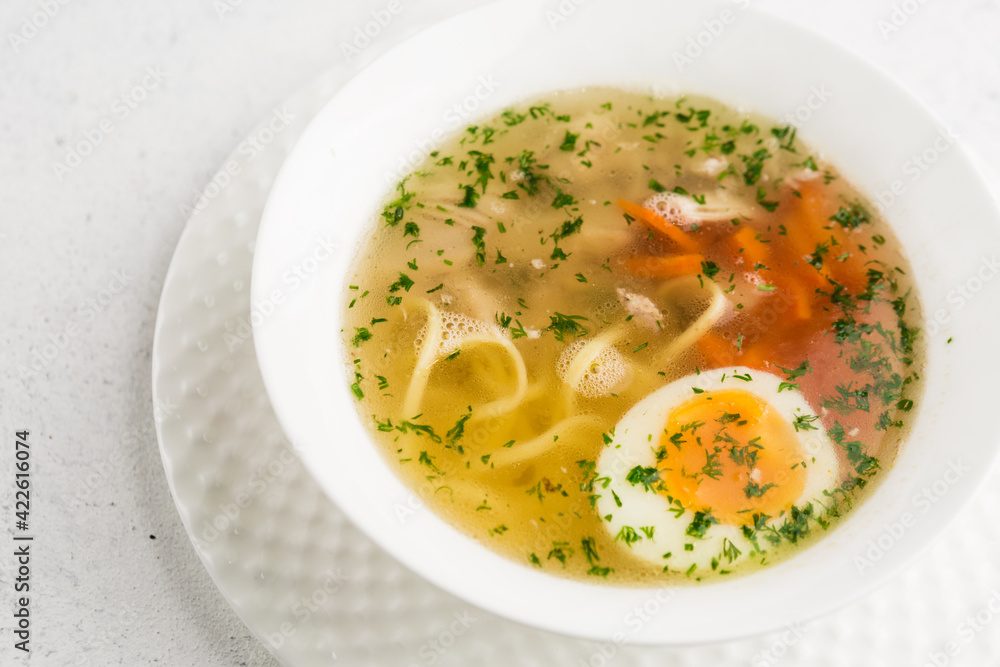 chicken broth with noodles and egg