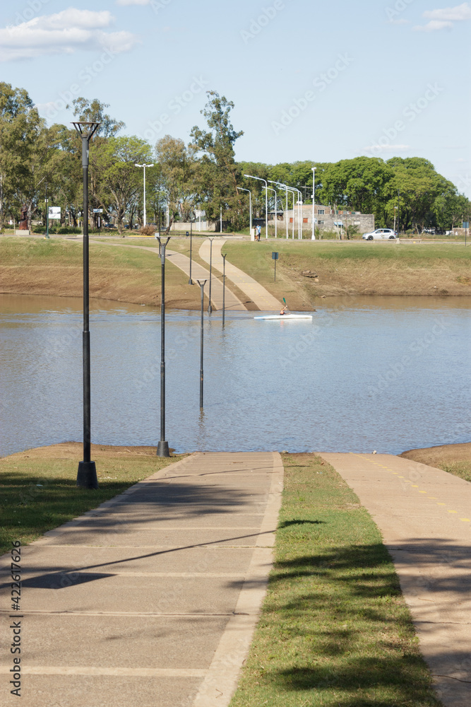 Flooded path that prevents people to cross the town on an argentinian city