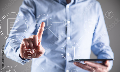 man holding phone with document icon