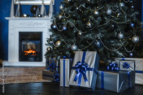 New Year's gifts under the Christmas tree close-up