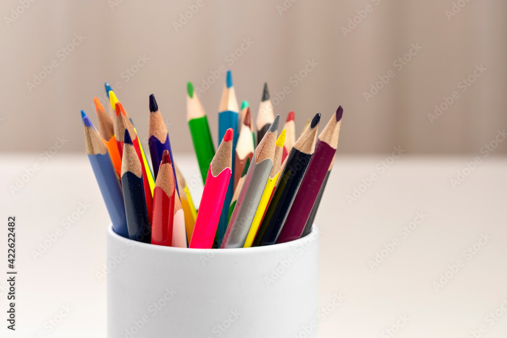 Fototapeta premium Colorful pencils in white cup.