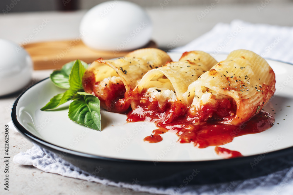 Pasta stuffed with cheese and fish in tomato sauce. Pasta stuffed with cheese and fish in tomato sauce.
